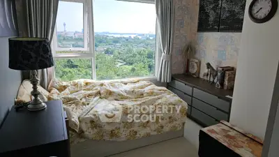 Cozy bedroom with stunning city view and elegant decor