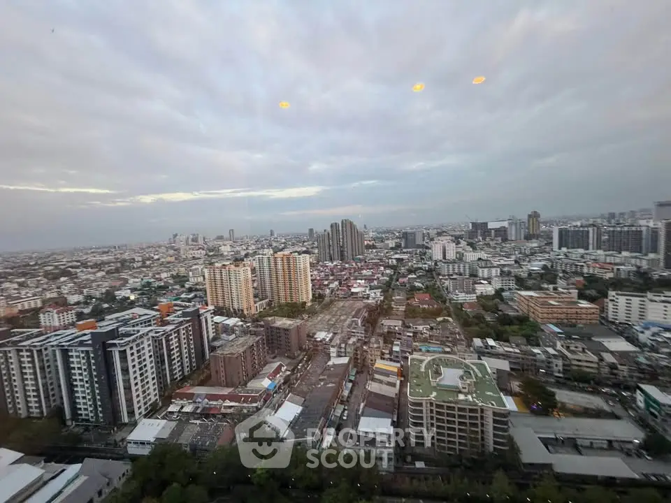Stunning cityscape view from high-rise building showcasing urban skyline and vibrant city life.
