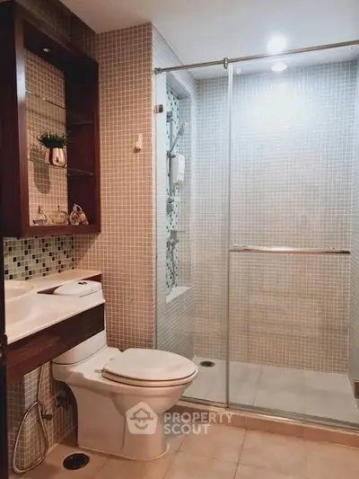 Modern bathroom with glass shower and elegant tile design