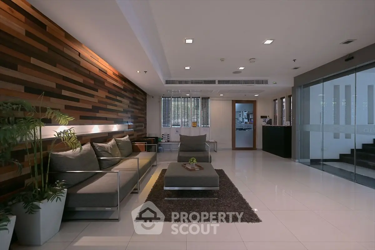 Modern living room with stylish wood paneling and sleek furniture