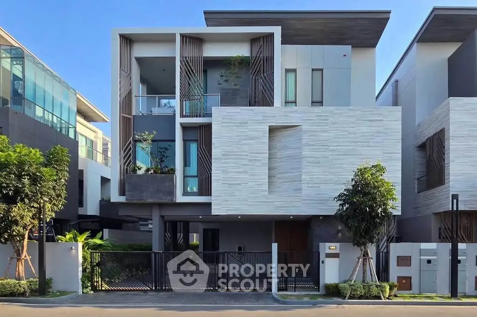 Modern luxury home exterior with sleek design and large windows in a contemporary neighborhood.