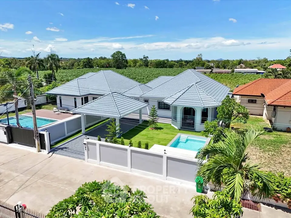Luxurious villa with private pool and lush garden in tropical setting