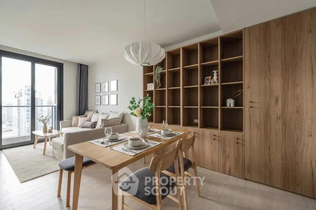 Modern living room with dining area and large windows offering city views