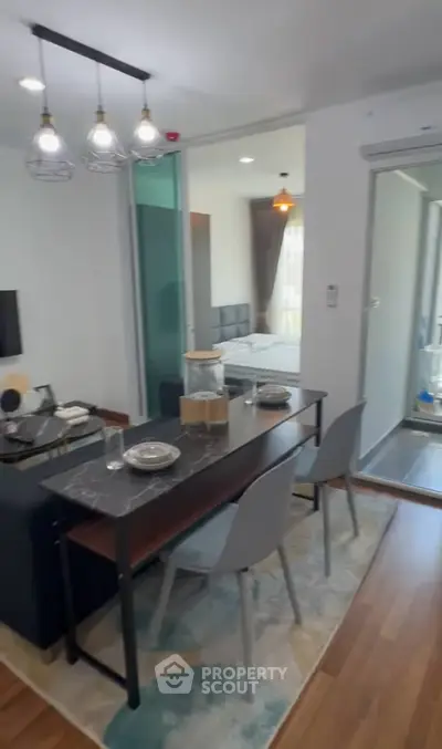 Modern open-plan living and dining area with stylish decor and natural light.