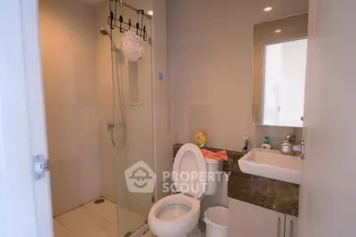 Modern bathroom with glass shower and sleek fixtures