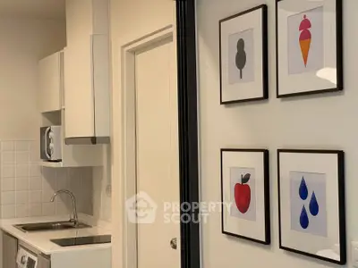 Modern kitchen with sleek design and artistic wall decor