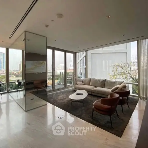 Luxurious modern living room with floor-to-ceiling windows and elegant furniture