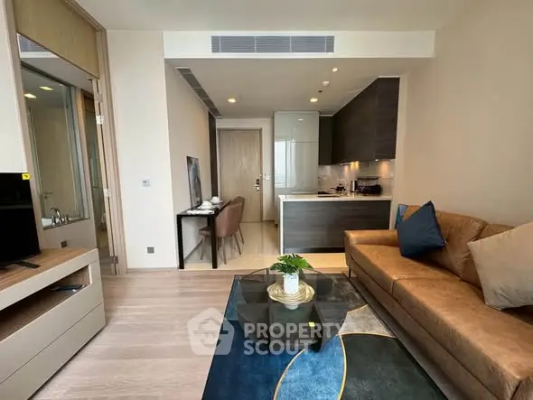 Modern living room with open kitchen and stylish decor