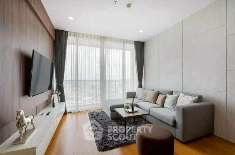 Modern living room with stylish decor and large window view
