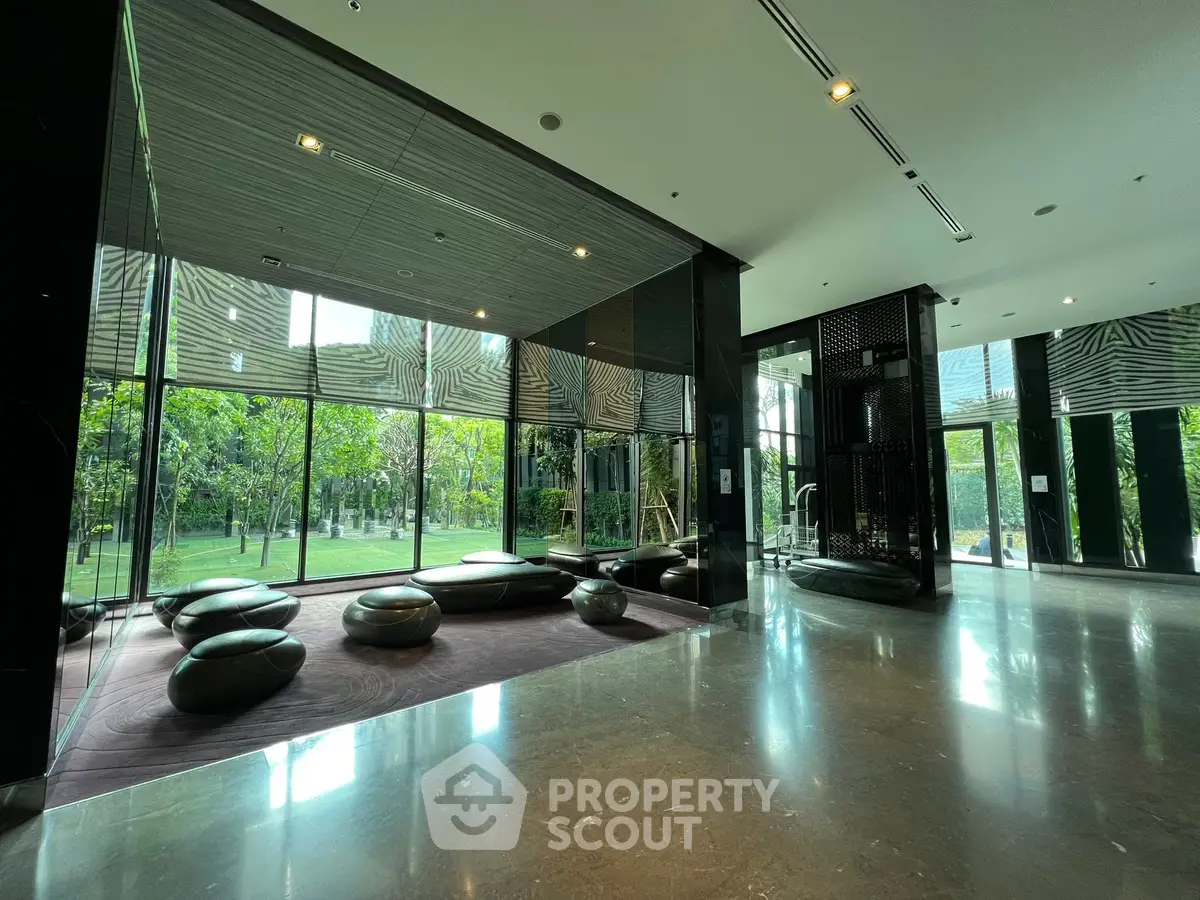 Luxurious modern building lobby with sleek design and garden view