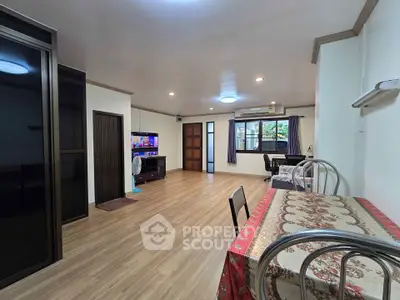 Spacious living room with modern decor and natural light