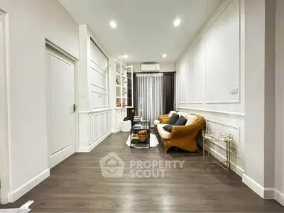 Spacious living room with elegant decor and cozy seating area