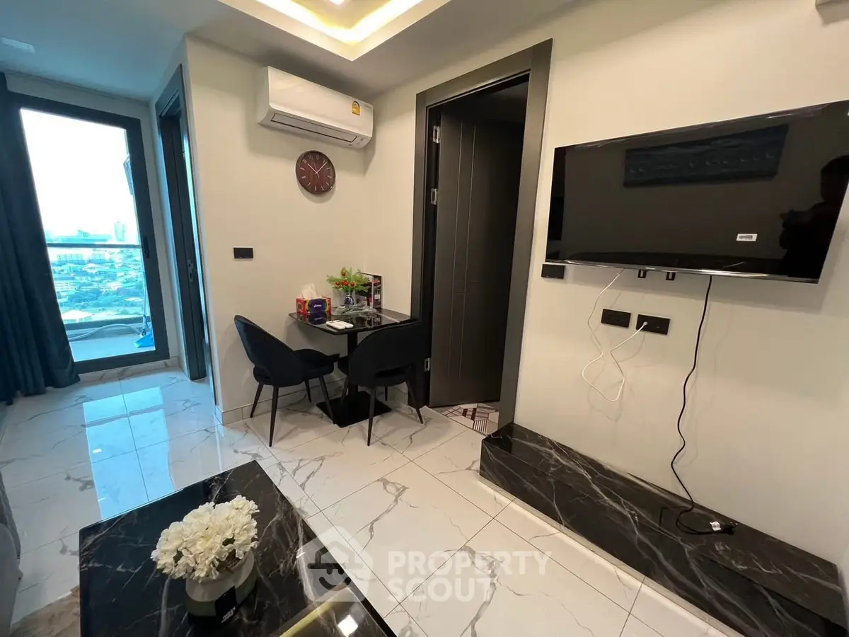 Modern living room with city view, sleek TV setup, and elegant marble flooring.