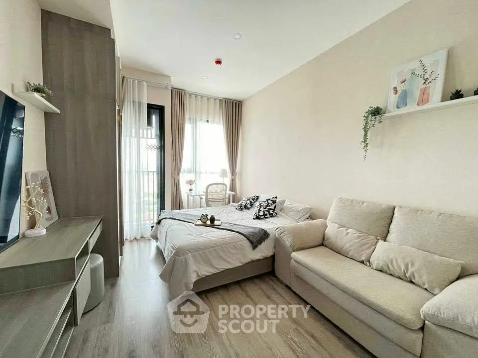 Modern living room with cozy sofa and stylish decor in a bright apartment.