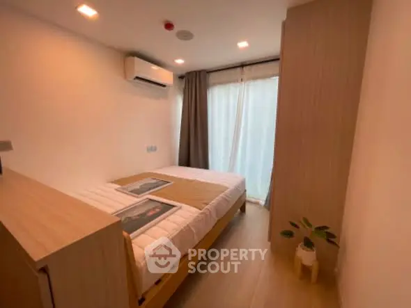 Cozy modern bedroom with natural light and minimalist decor