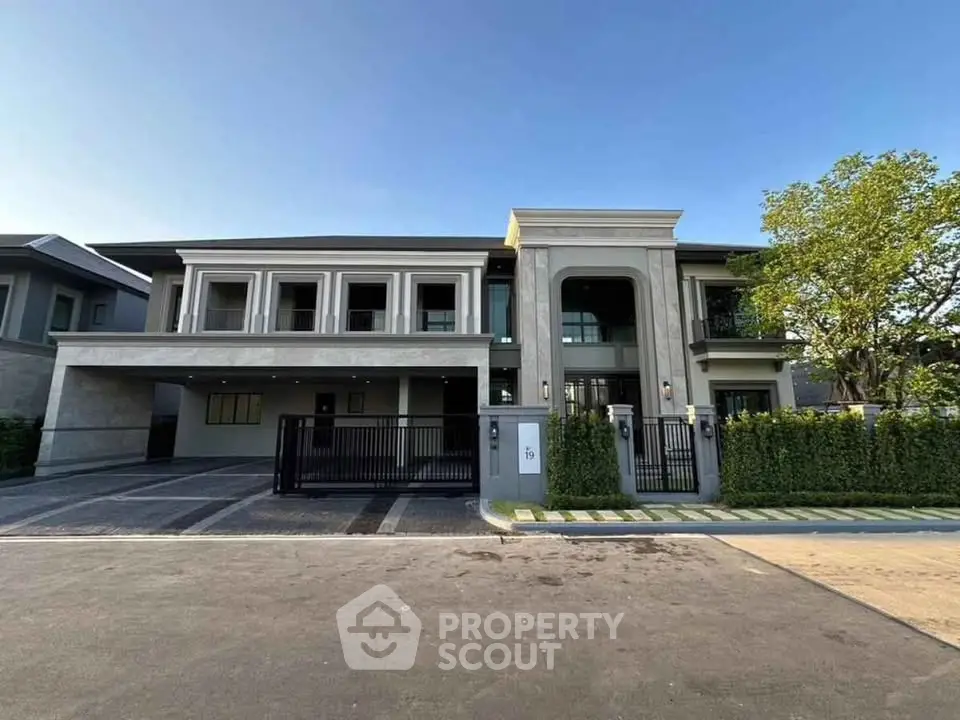 Luxurious modern mansion with grand entrance and spacious driveway