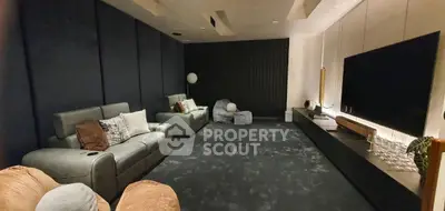 Luxurious home theater with plush seating and large screen for ultimate entertainment experience.