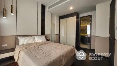 Modern bedroom with elegant design and ensuite bathroom in luxury apartment