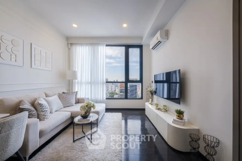 Modern living room with city view, stylish decor, and natural light
