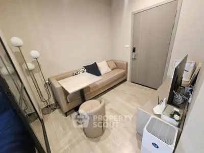 Modern living room with cozy sofa and sleek TV setup