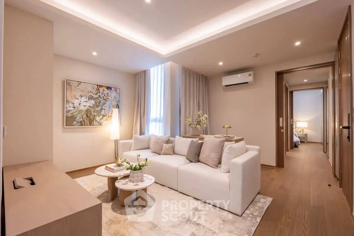 Elegant living room with modern decor and cozy ambiance in a luxury apartment.