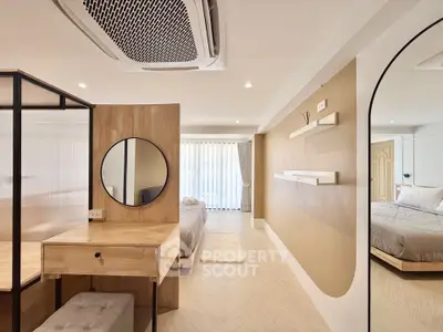 Spacious modern bedroom with stylish decor and natural light
