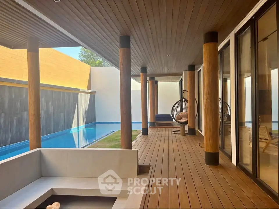 Luxurious modern patio with wooden deck and private pool, perfect for relaxation and entertainment.