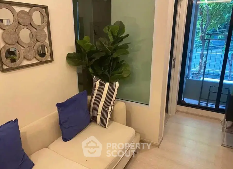 Cozy living room with modern decor and balcony view