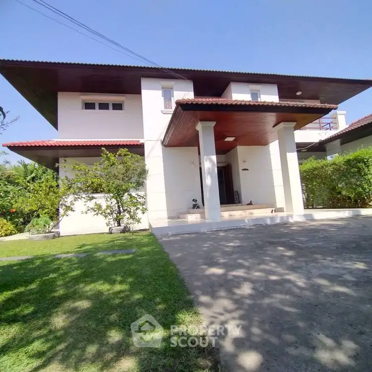 Stunning modern house with lush garden and spacious driveway in serene neighborhood.