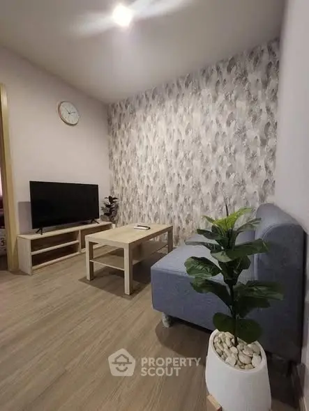 Modern living room with stylish decor and cozy seating area, perfect for relaxation.