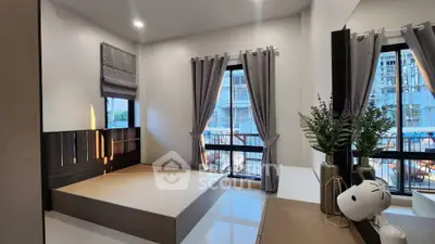 Modern bedroom with large windows and stylish decor