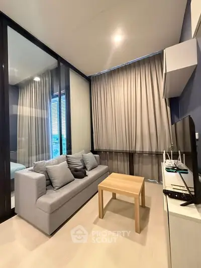 Modern living room with cozy sofa, wooden table, and large windows with curtains in a stylish apartment.