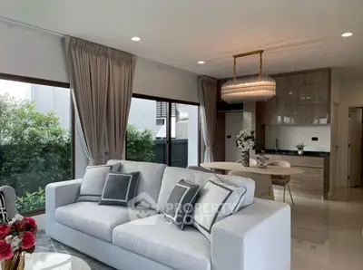 Spacious modern living room with elegant decor and open kitchen layout