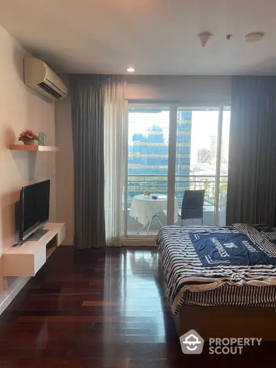 Modern bedroom with balcony view in urban apartment