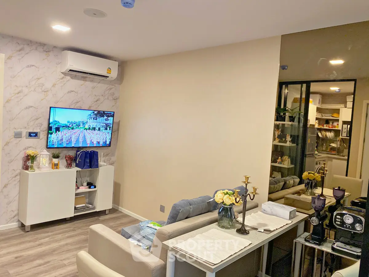 Modern living room with stylish decor and open kitchen layout