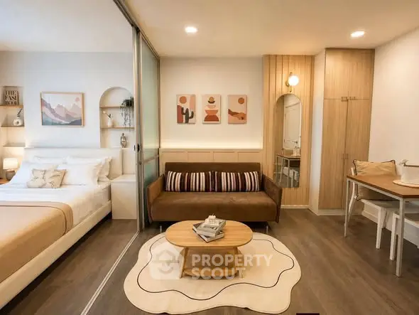 Modern studio apartment with cozy living area and stylish decor