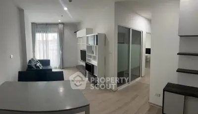 Modern living room with sleek furniture and natural light in a contemporary apartment.