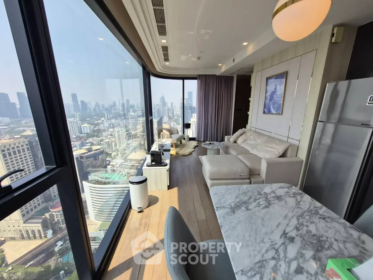 Luxurious high-rise living room with panoramic city views and modern furnishings