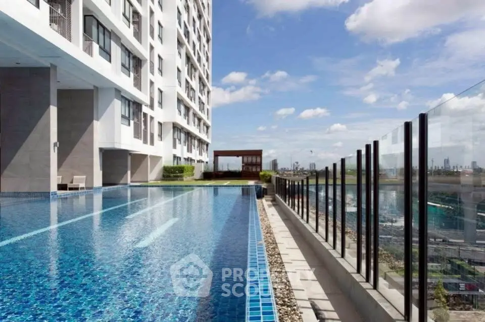 Luxurious high-rise building with stunning rooftop infinity pool and city skyline view.