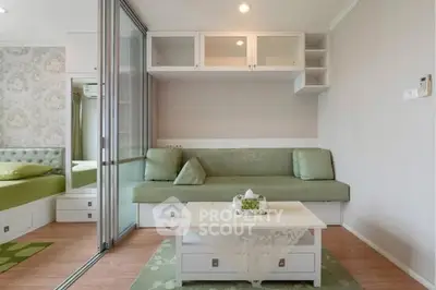 Modern living room with green accents and sliding glass doors