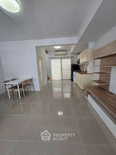 Spacious open-plan living area with modern kitchen and dining space