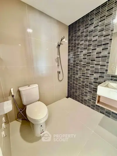 Modern bathroom with sleek tiles and contemporary fixtures