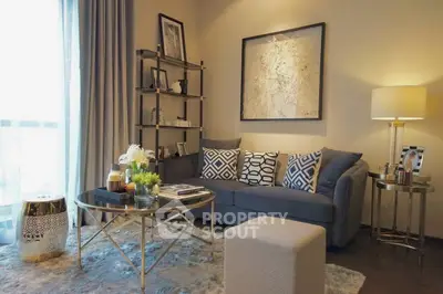 Stylish living room with modern decor, cozy sofa, and elegant lighting.