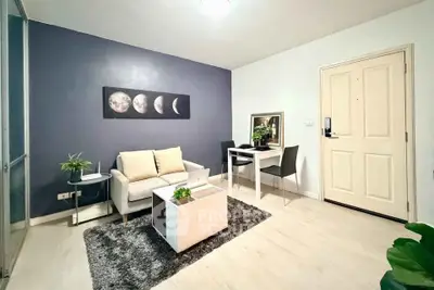 Modern living room with stylish decor and cozy seating area, perfect for relaxation and entertaining.