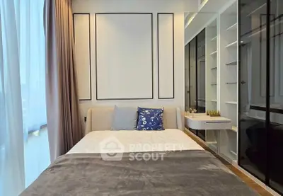 Modern bedroom with elegant decor and large window for natural light.