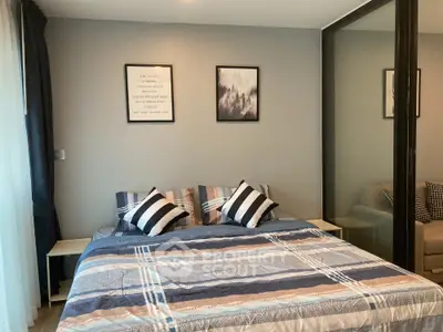Modern bedroom with stylish decor and large bed in cozy apartment