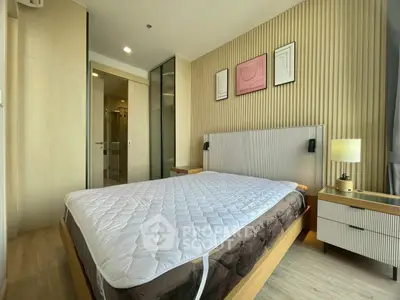 Modern bedroom with stylish decor and natural light in a luxury apartment