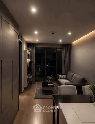 Modern living room with cozy lighting and stylish furniture, featuring a large window with city view.