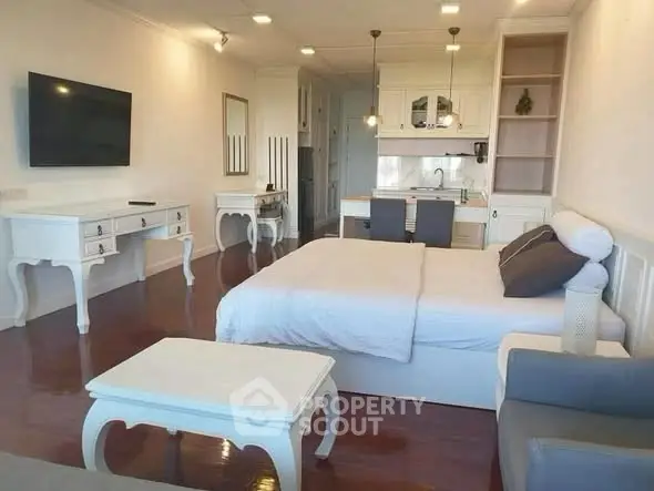 Spacious studio apartment with elegant furniture and modern kitchen