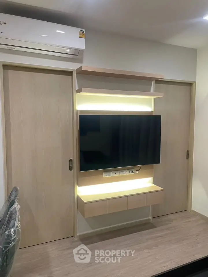 Modern living room with sleek TV unit and ambient lighting